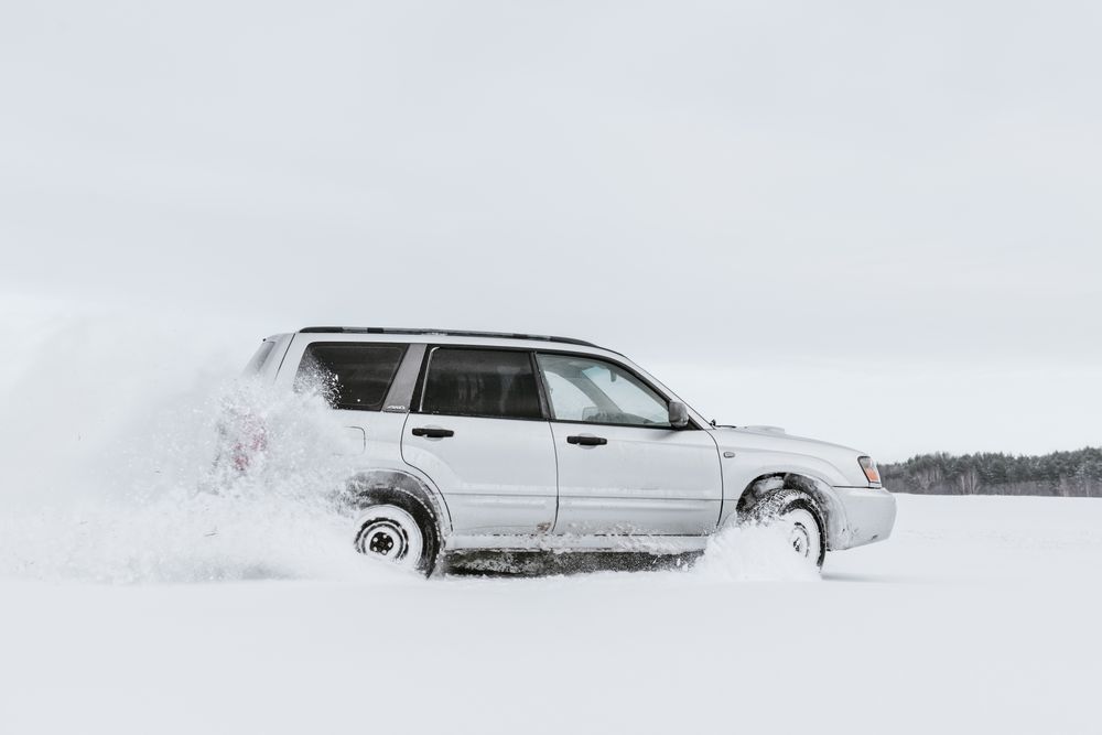 Car driving on snow field