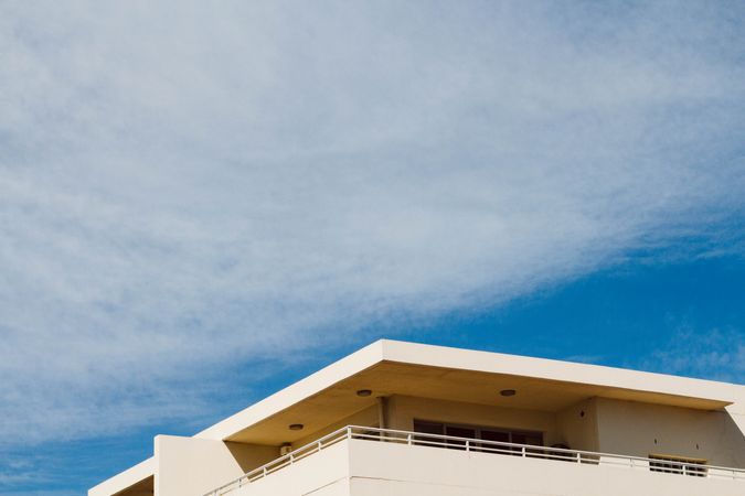 Modern White Building Against A Clear Blue Sky On A Sunny Day