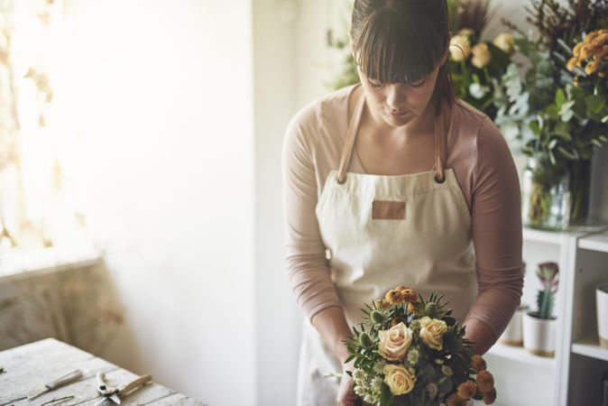 Florist creating bouquet