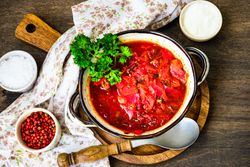 Top view of traditional red Ukrainian soup borscht