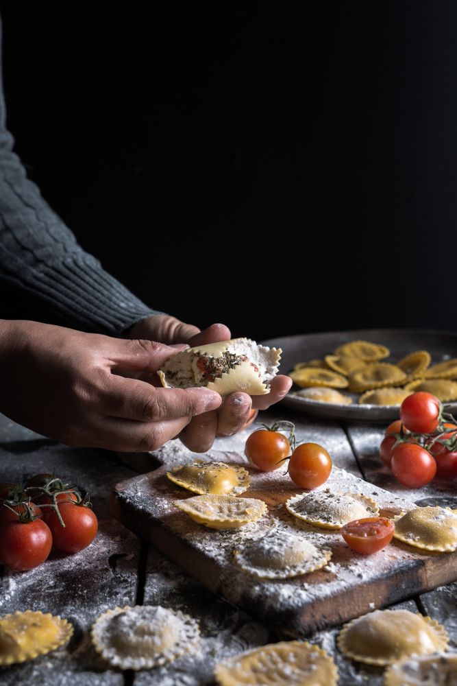 Homemade ravioli made with parmesan cheese, tomato and basil.