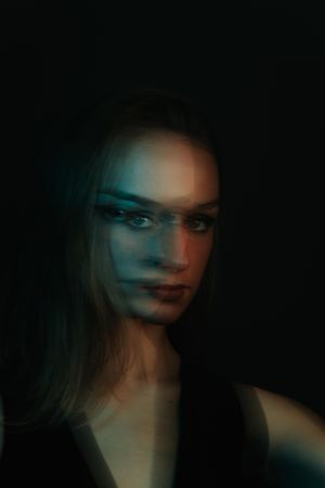 Blurry portrait of woman in UV light