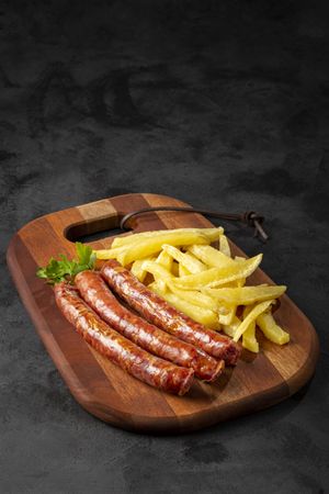 Grilled German sausage with french fries.