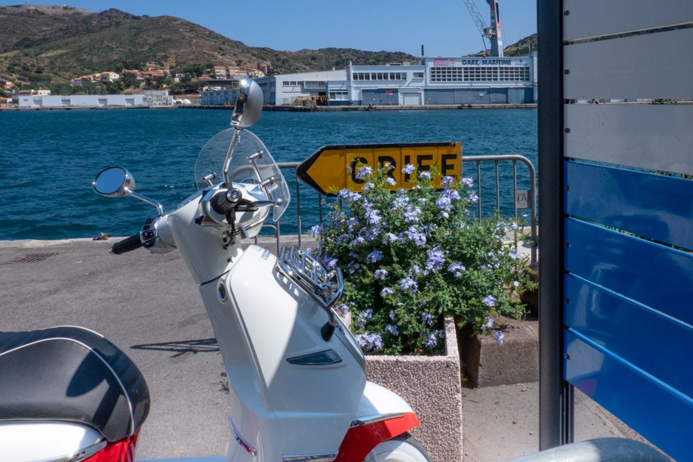 Vespa parked on pier
