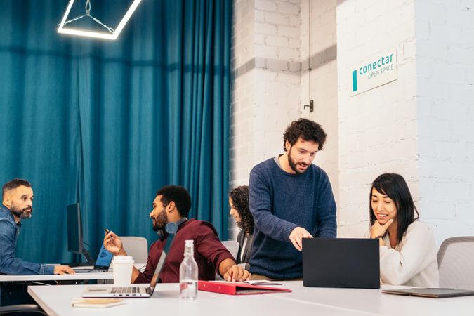 Group of multiracial people working with laptop in a coworking
