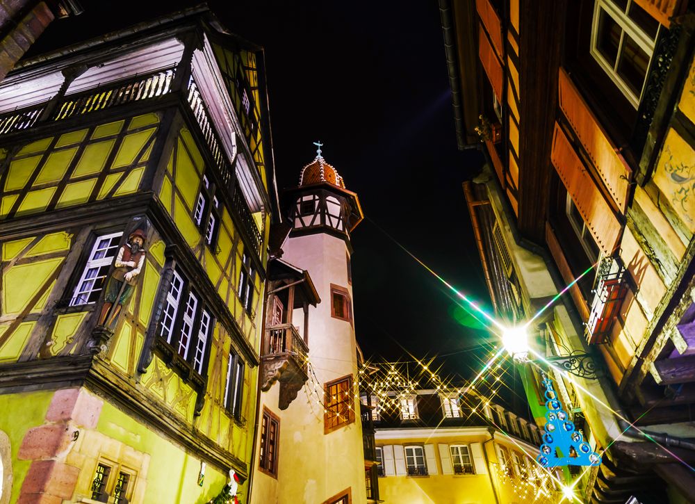 Bright street and house decorations at Christmastime in Colmar, Alsace, France