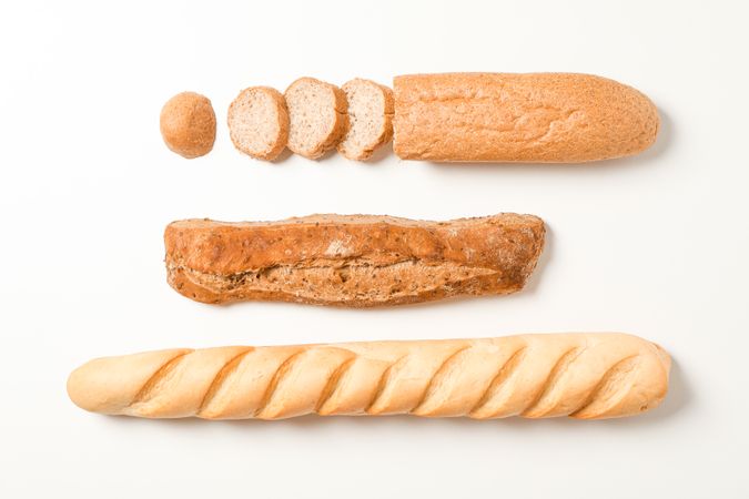 Flat lay composition with bakery products on blank background, space for text