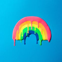 Melting rainbow on blue background