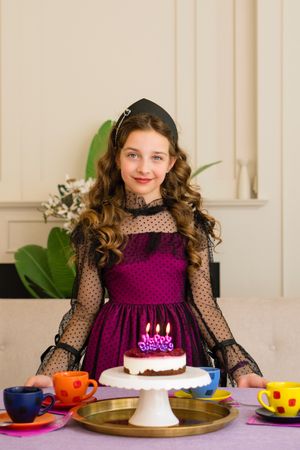 Girl in elegant dress celebrates birthday