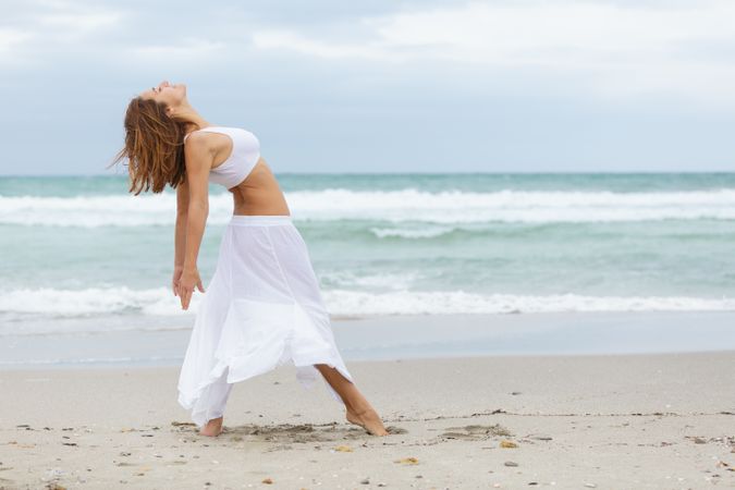 woman dancing near sea