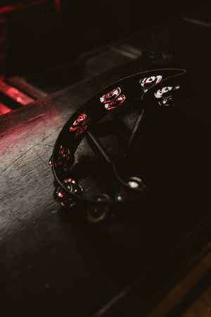 Tambourine reflecting club light on rack