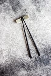 Asian table setting with chopsticks on grey counter