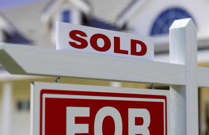 Sold For Sale Real Estate Sign In Front of New House.