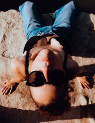 Young woman relaxing on rock