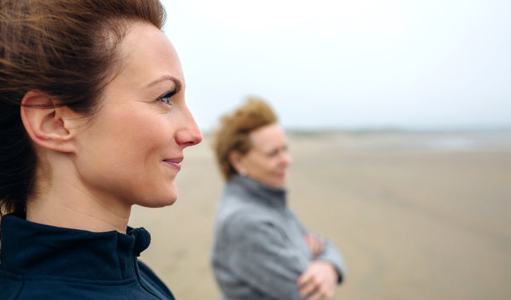 Two women looking at sea