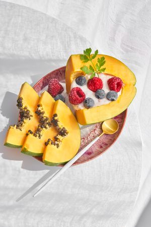 Yummy papaya dessert with berries