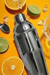 Concept of preparing cocktail, shaker, top view