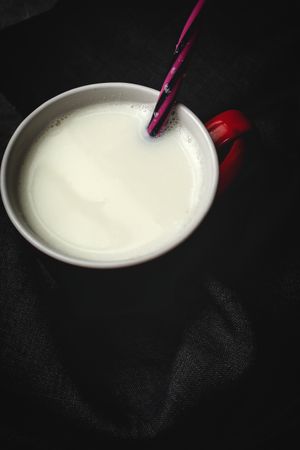 Cup of milk on table