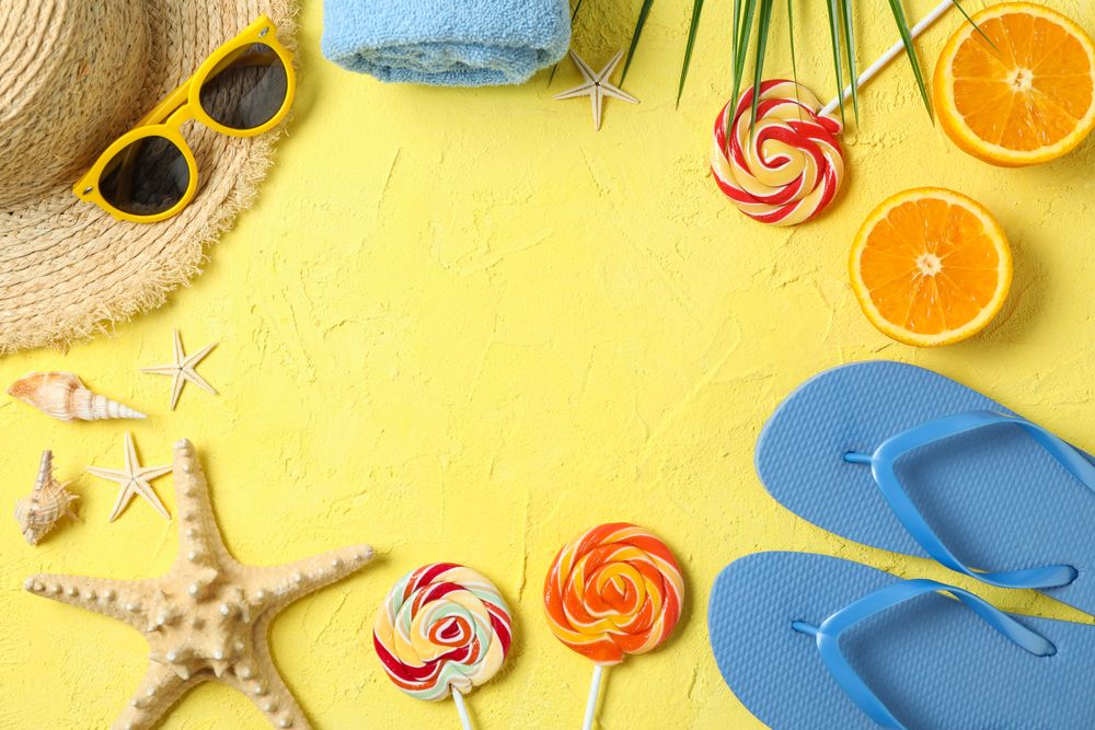Flat lay composition with summer vacation accessories on color background, space for text and top view. Happy holidays