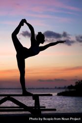 Silhouette photography of woman doing yoga during sunset 41nolb
