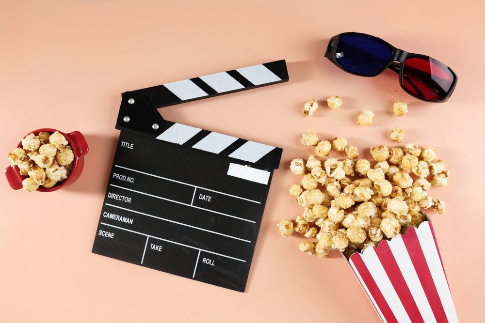 Top View Popcorn in Buckets, Movie Clapper, and 3D Eyeglasses