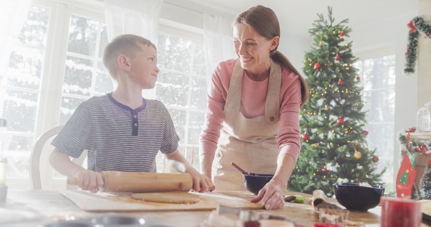 Portrait of Mother and Son Baking Together During Christmas.
