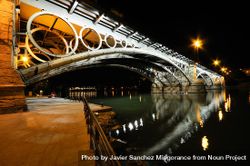 Under the Triana Bridge over Guadalquivir river at sunset with river reflections 48BLZq
