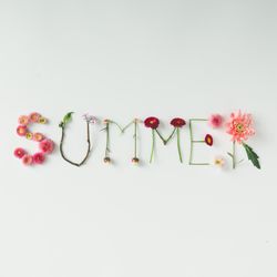 Word "SUMMER" made of flowers on bright background
