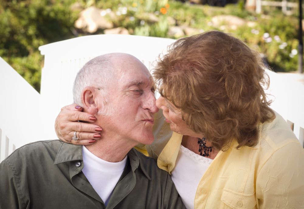 Mature Couple Kissing in the Park