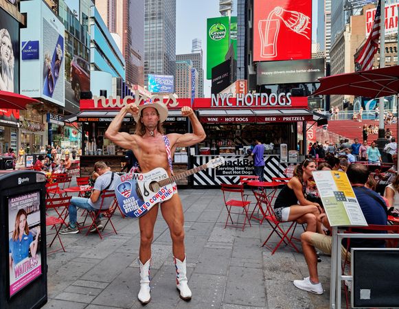 Naked Cowboy fleing his muscles in Times Square, New York City, New York