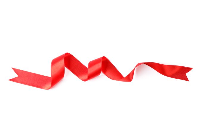 Red ribbon isolated on blank background. Gift concept