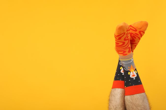 Casual clothes and wearing concept - socks, clothes for foot