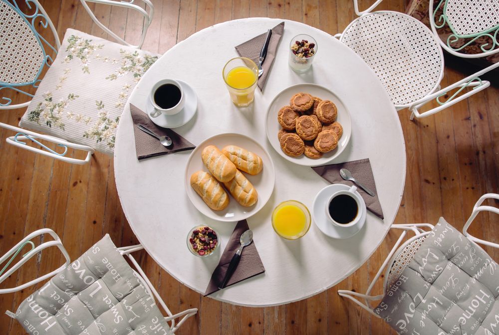 Top view of juice, coffee and breakfast pastries