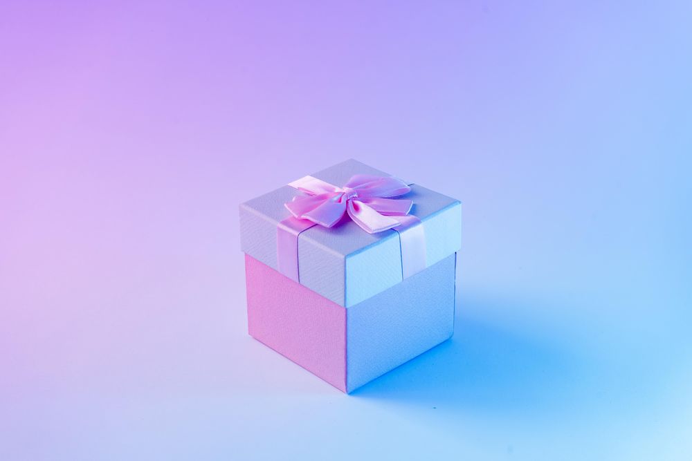 Wrapped present on vibrant bold gradient holographic colors