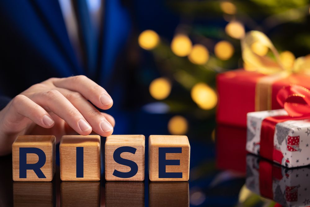 Businessman Showing Rise Blocks Holiday