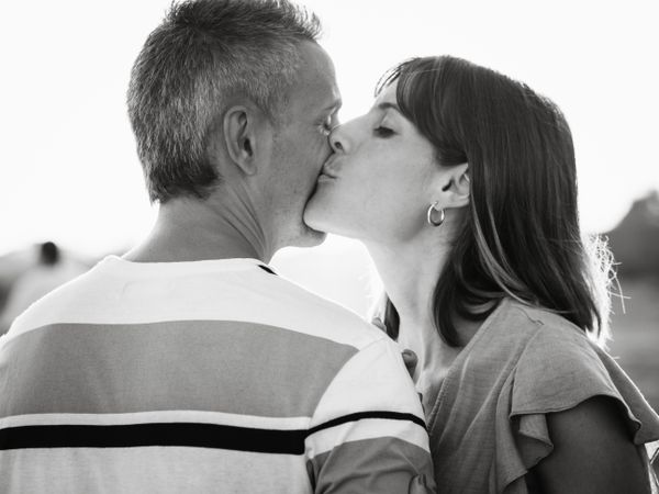 Adult couple embracing near sea