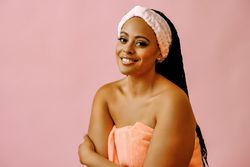 Portrait of happy woman with her hair back in spa headband
