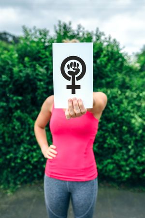 Woman showing symbol of feminism