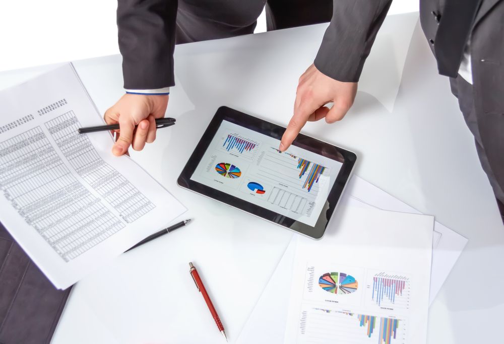 Business people analyzing documents in a meeting