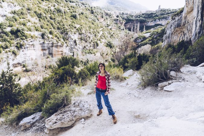 Female traveler in mountainous terrain