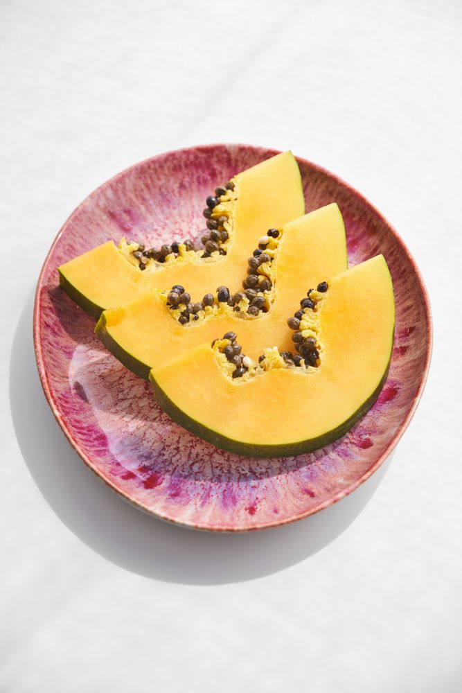 Sliced ripe papaya on plate