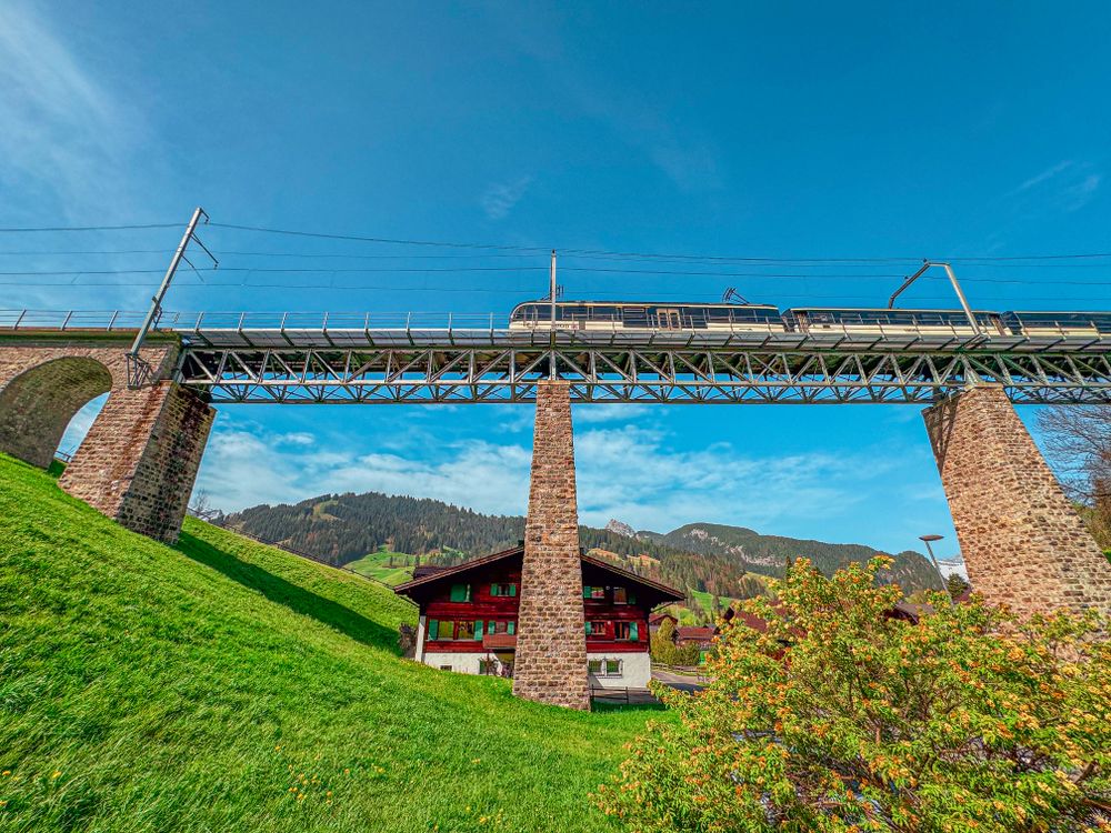 Train crossing over Gstaad viaduct, Switzerland