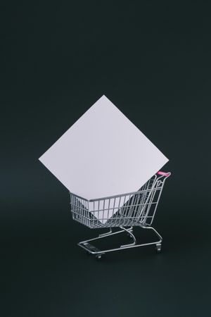Shopping cart with square box on dark background