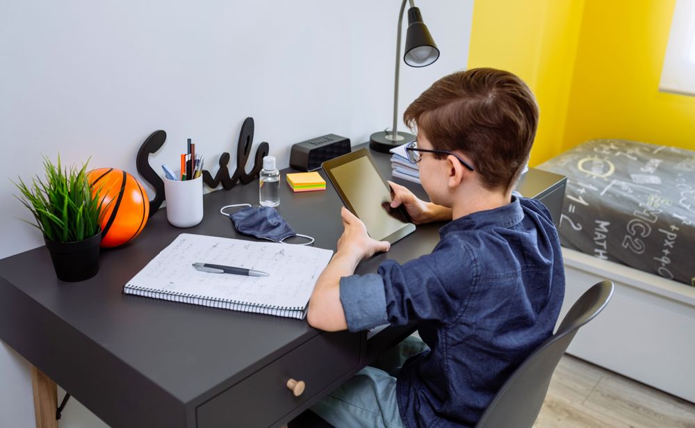Teenager doing homework with a tablet