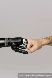 Robot and person's hand fist bump 5kMj3b
