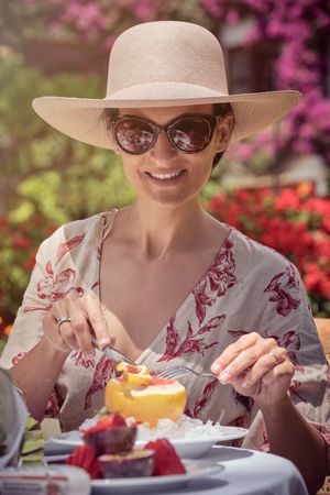 Woman Enjoying Breakfast in the Garden