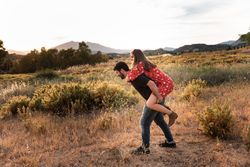 Happy couple having fun together in park