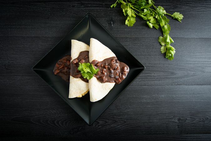Veracruz eggs wrapped in tortillas decorated with sauce
