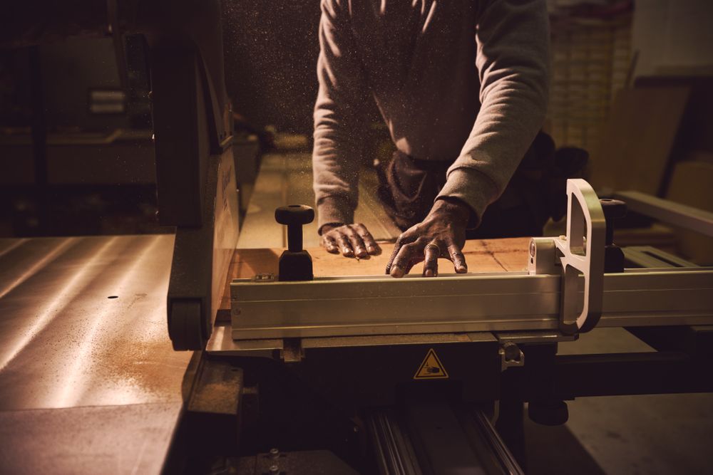 Person measuring wood at work
