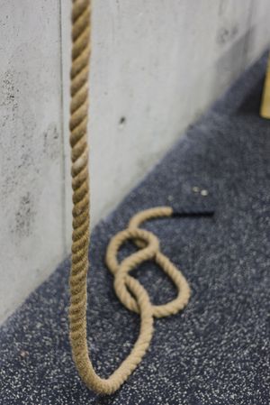 Rope hanging near wall in gym